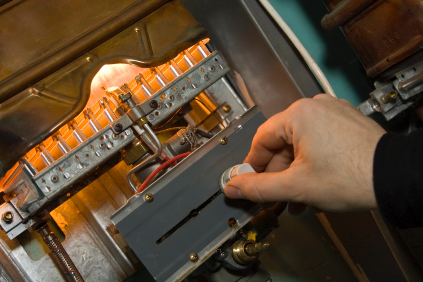 Close-up of a Hixon technician servicing a gas furnace near Suwanee, GA
